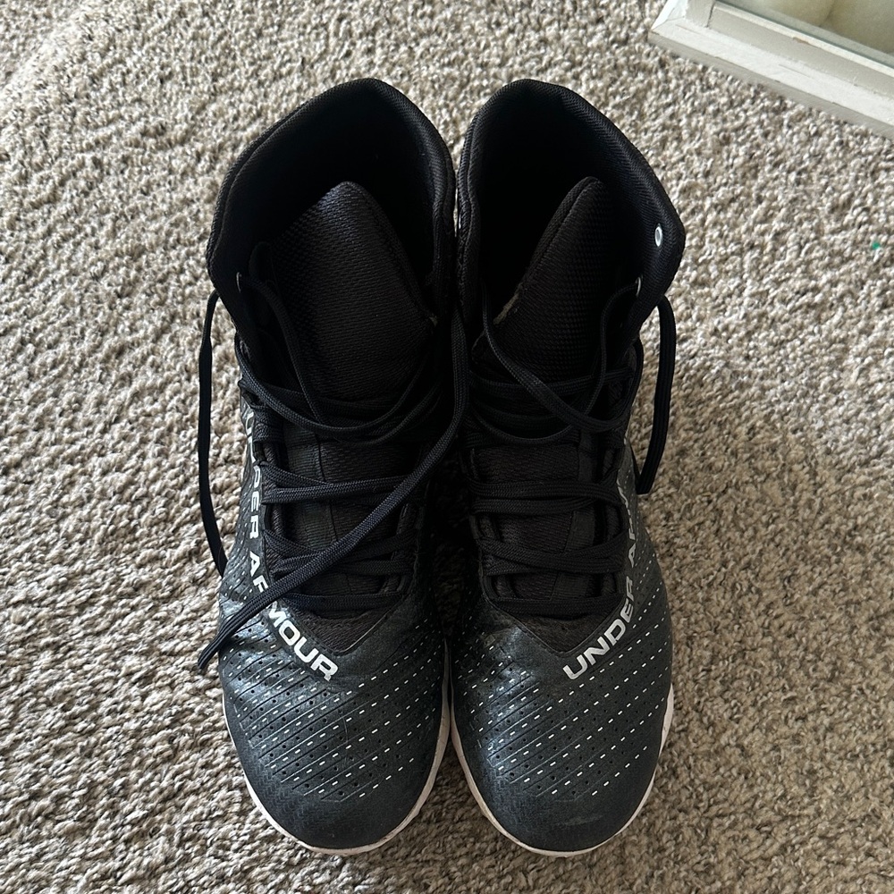 Under Armour Black and White High-Top football cleats